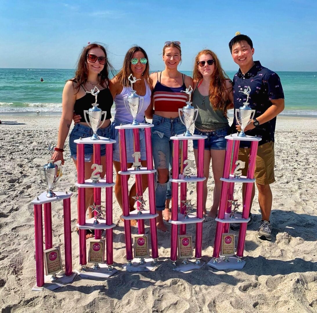 Group image of so many people along with trophy