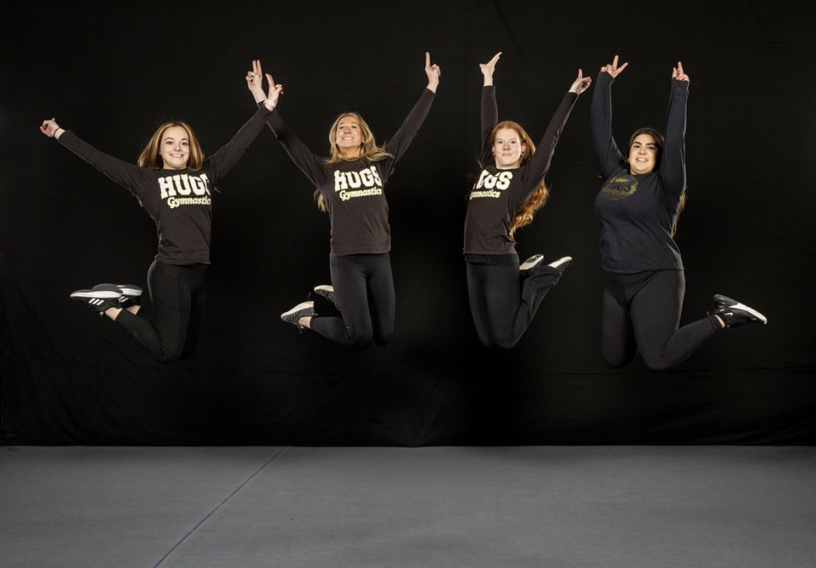 A beautiful shot of four girls jumping in the air