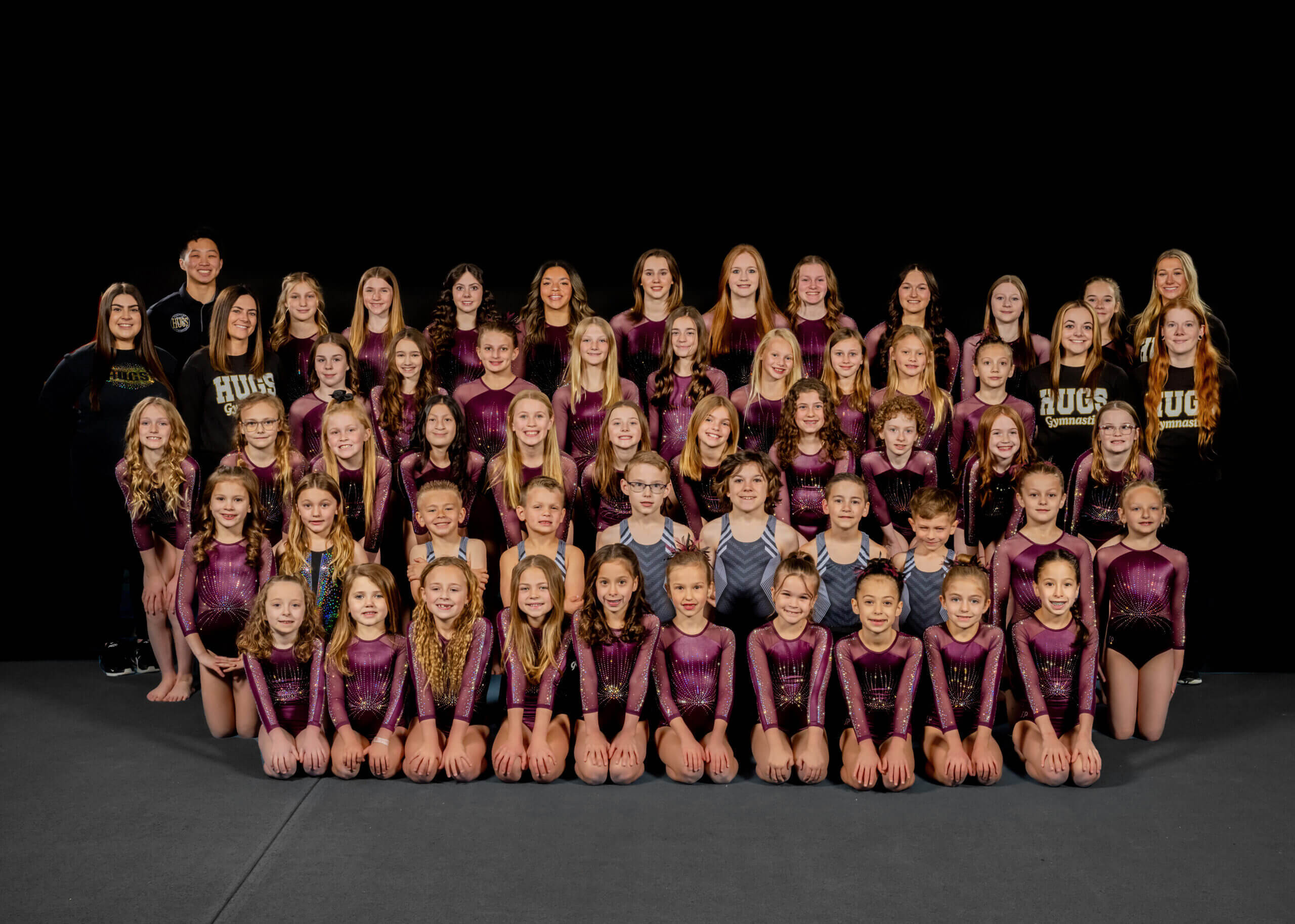 Large gymnastics squad arranged for team photo